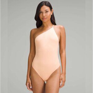 Lululemon | Wundermost One-Shoulder Bodysuit in Peach Bellini - Small